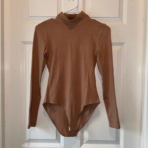 Tan turtleneck bodysuit